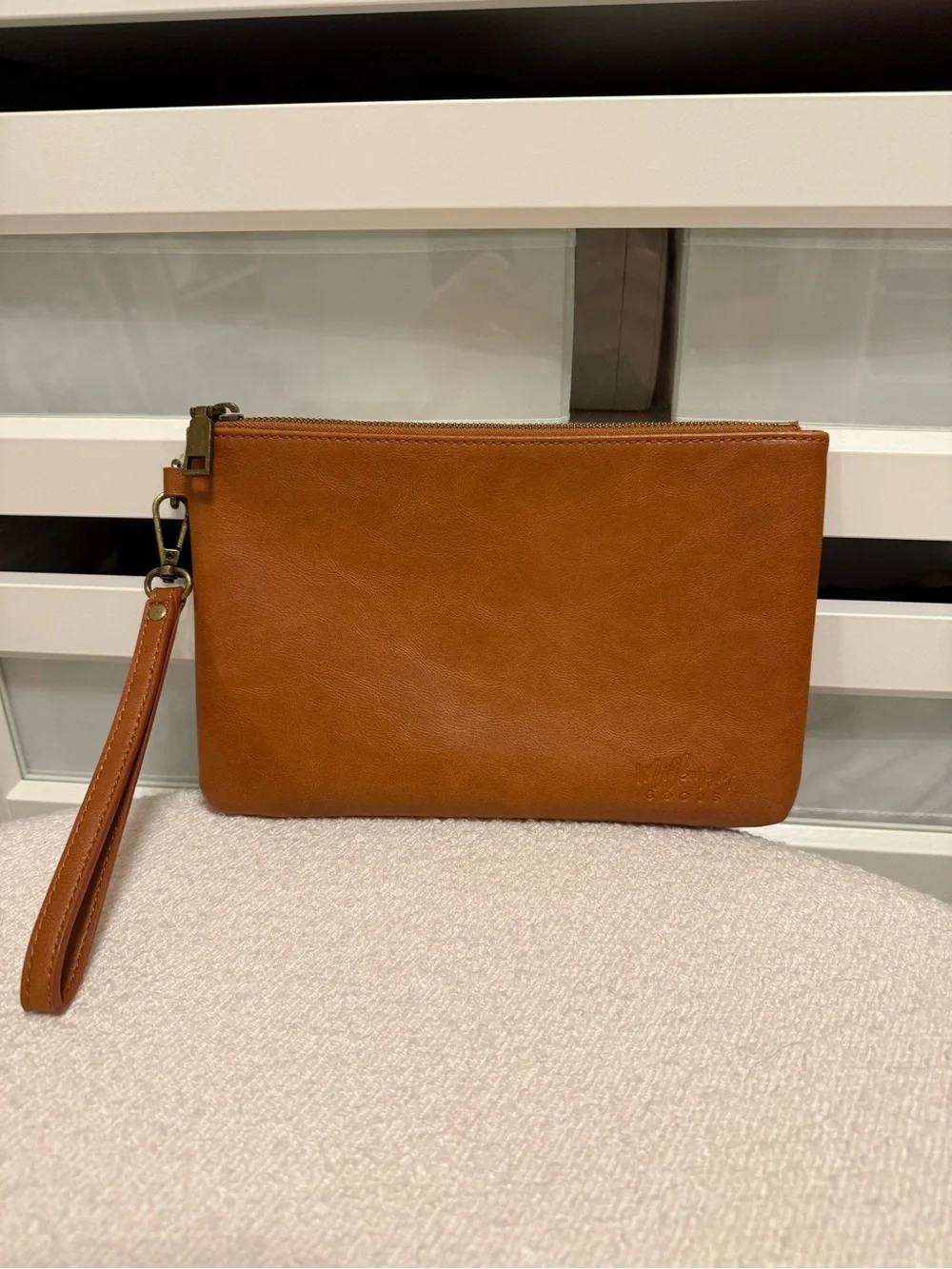 Milkmaid Goods camel colored wristlet clutch